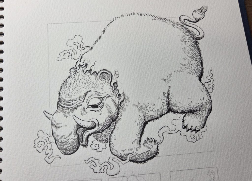 洋伯が万年筆で妖怪獏のペン画を描いている。制作途中の写真