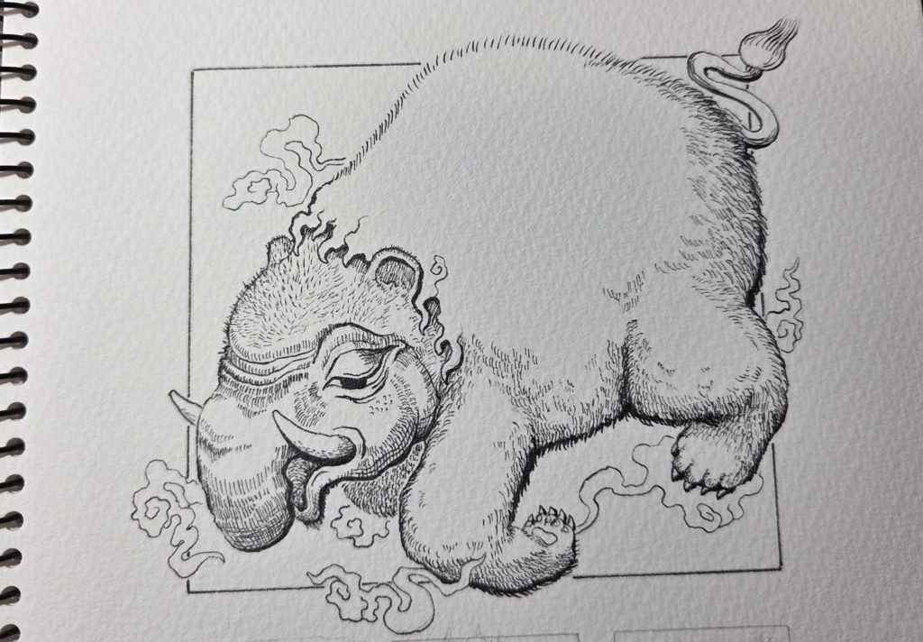 洋伯が万年筆で妖怪獏のペン画を描いている。制作途中の写真