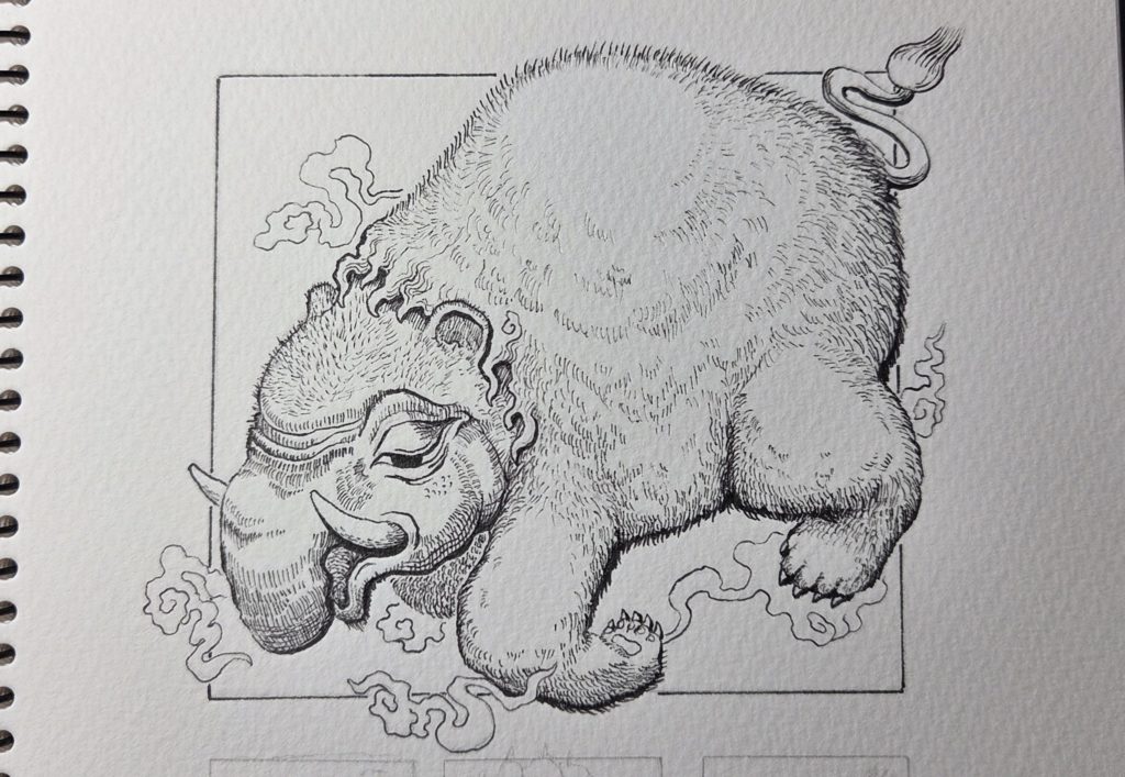 洋伯が万年筆で妖怪獏のペン画を描いている。制作途中の写真