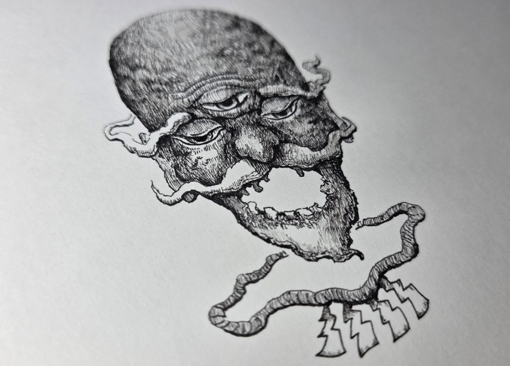 万年筆で描いた妖怪海の怪のイラストを斜めから撮った写真